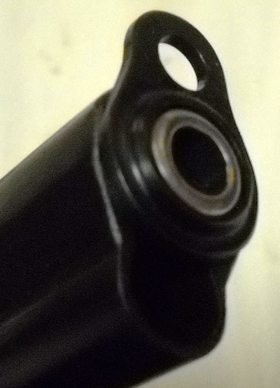 detail, TTC barrel bushing rotated 180 degrees for removal